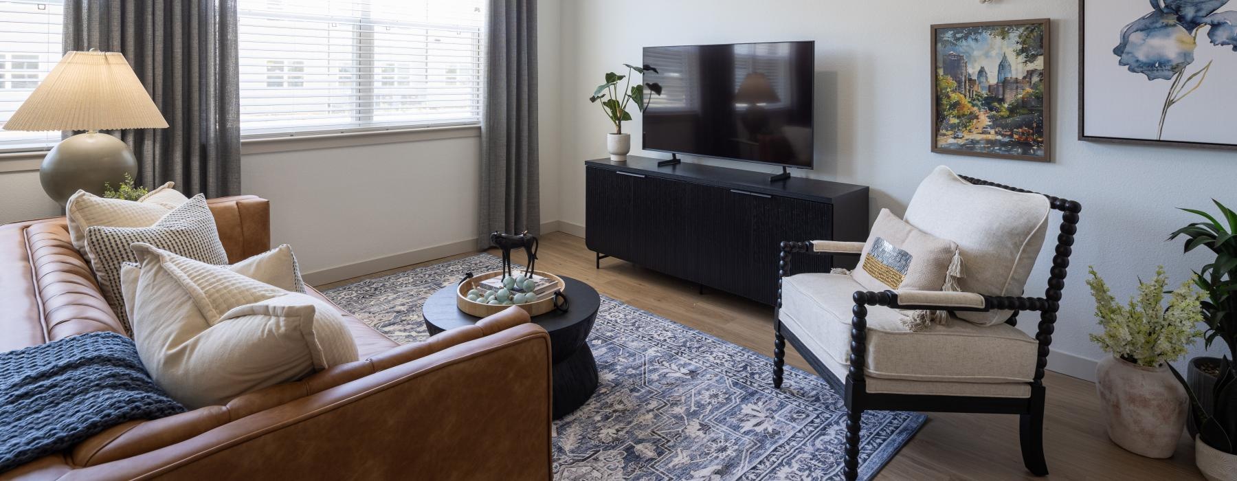 a living room with a tv and couches
